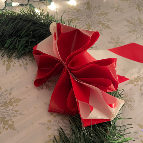 A Ribbon made with White and Red Barricade Tape